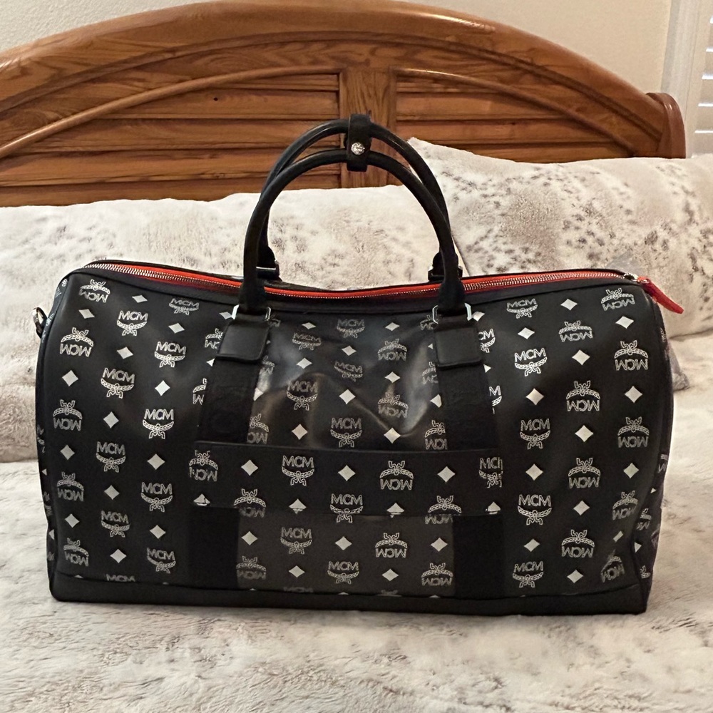Authentic Black MCM TRAVEL DUFFLE BAG with strap & dust bag in great condition.